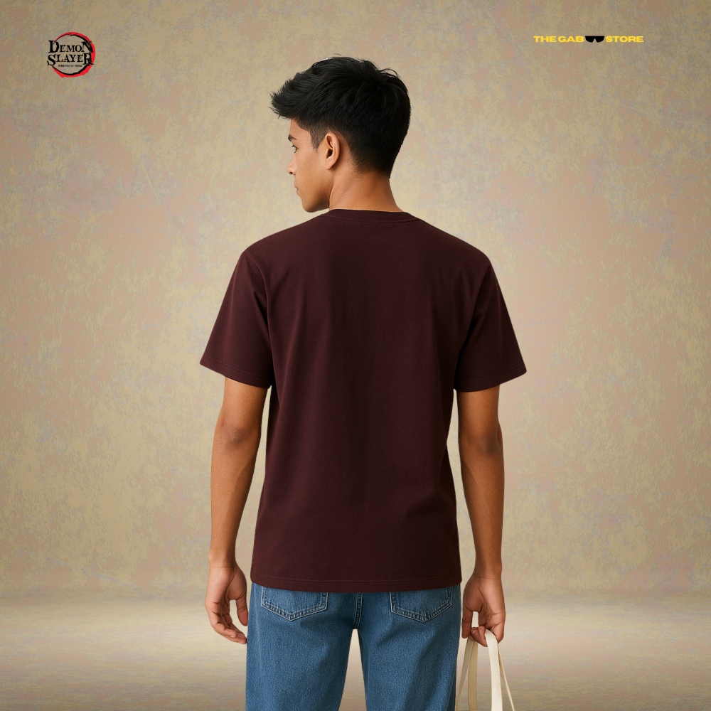 A man wearing a brown premium cotton t-shirt with a anime character design from Demon Slayer