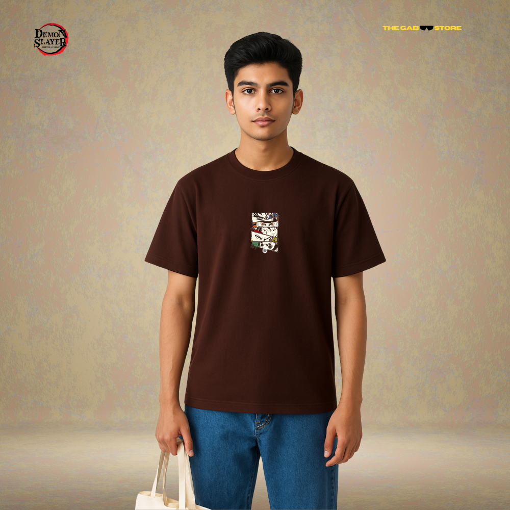 A man wearing a brown premium cotton t-shirt with a anime character design from Demon Slayer