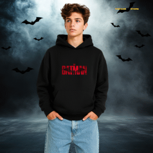 Young person in a black hoodie with "The Batman" logo stands confidently against a misty, moonlit backdrop with silhouetted bats. Moody, mysterious vibe.